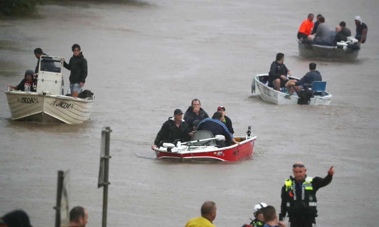 People in rescue boats on floodwater in Lismore, from the Guardian’s 28 February 2022 report