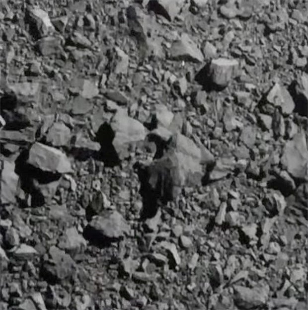 Rock-covered surface of Dimorphos in a final DART camera image shown in CBS’s original impact report